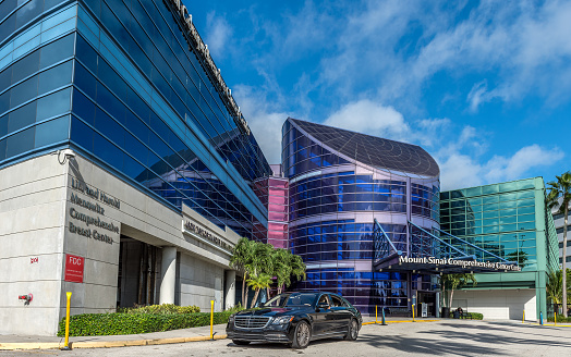 Miami Beach, United States - October 26, 2021: View of the Comprehensive Cancer Center Building, it is one of the Mount Sinai Medical Center facilities. Mount Sinai Medical Center is Florida's largest private, independent, and non-profit teaching hospital. It currently has 15 different buildings / pavilions.