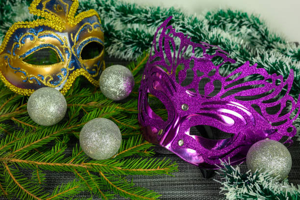 Christmas masks, balls, tinsel on a white background. stock photo