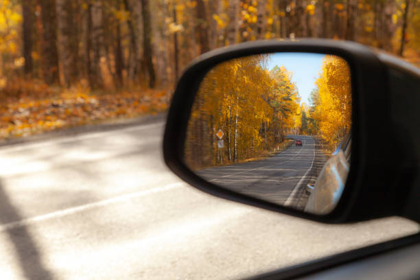 istock The car's rearview mirror reflects a sharp turn 1349232501