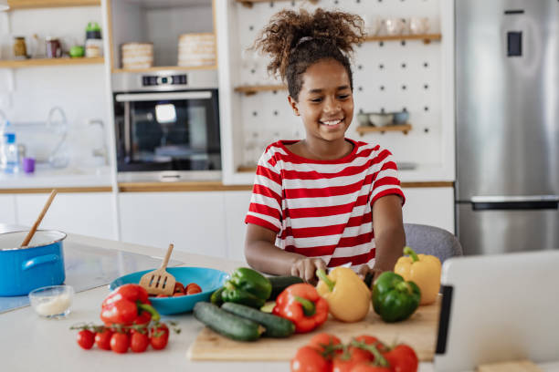 istock Young girl preparing a healthy meal 1349232759