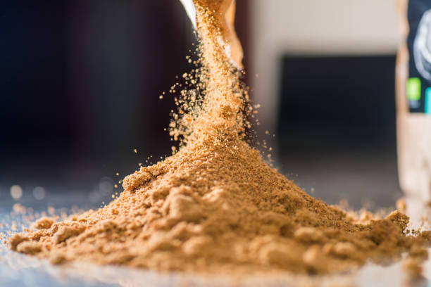 Yellow powder crumbles into a heap. Bakery concept