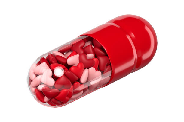 istock Medicinal capsule with heart-shaped granules on a white background. Isometry. 3d rendering. 1349234159
