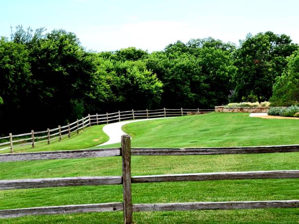 istock Split rail fence next to trail on edge of forest 1349235682