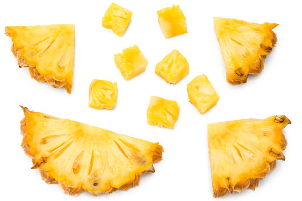 istock sliced pineapple isolated on white background. exotic fruit. clipping path. top view 1349235725