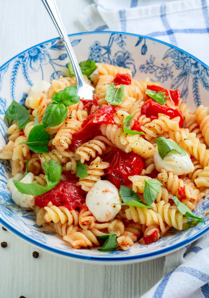 istock Pasta with baked caprese. 1349237597