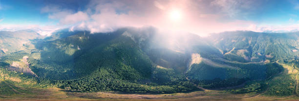 istock Flight over the misty mountain Syvulya 1349239605