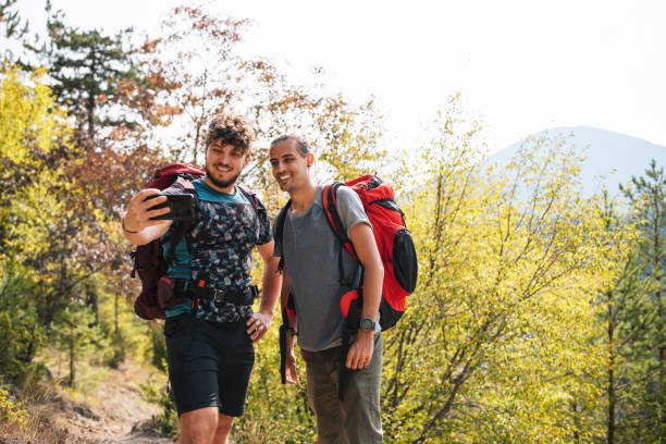 istock Male Friends Taking A Selfie While Hiking 1349241648