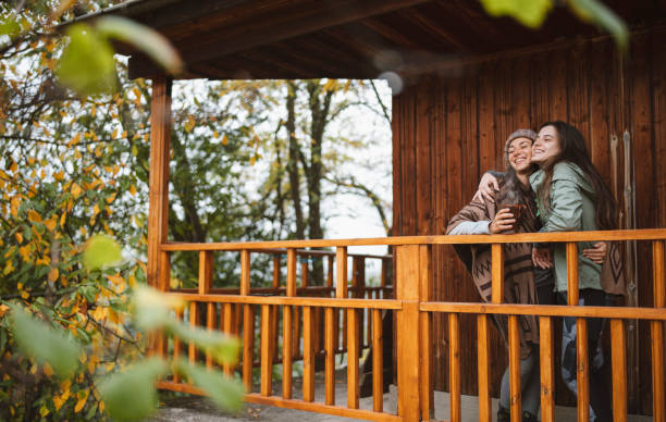Man in love comforting his smiling woman outdoor