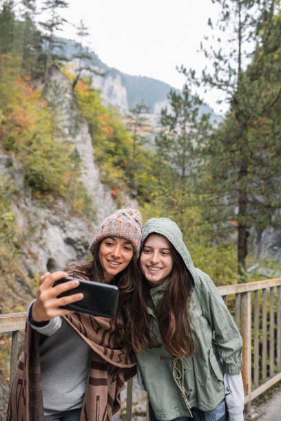 istock Two Women Taking A Selfie On Autumn Background 1349241665