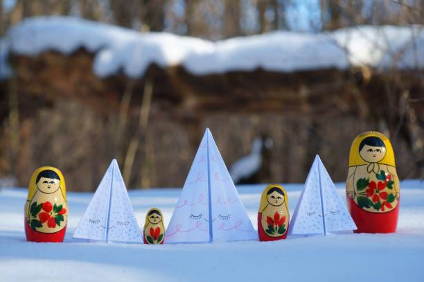 istock Paper toy Christmas trees in a snowy forest. 1349242223