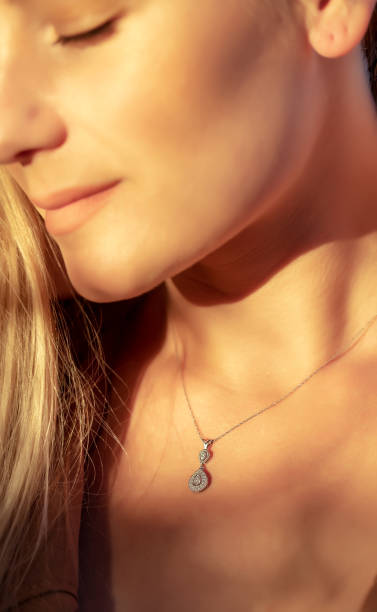 istock Girl with a Beautiful Pendant on her Neck 1349246410