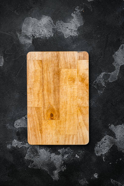 istock Scratched chopping board, on black dark stone table background, top view flat lay , with copy space for text or your product 1349246938