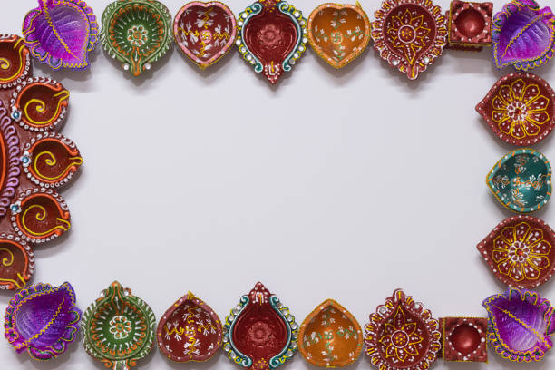 istock Eco Friendly Handmade Handcrafted earthen large or big floral and small Clay Diya Deep Dia arranged as a border frame background with copy space 1349248022