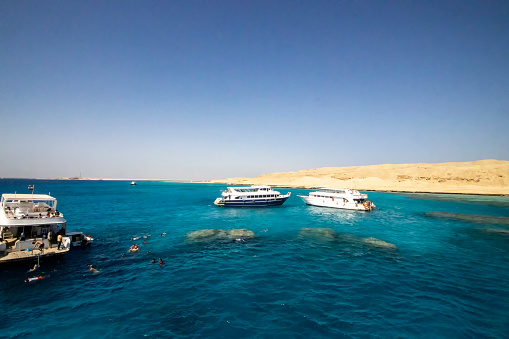 Holidaymakers enjoying the sea and sun at Small Giftun island near Hurghada, Egypt
