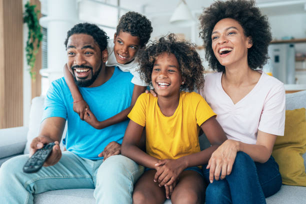 istock Family watching television 1349249673