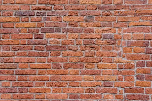 istock Old brick wall. Brickwork from an old brick in a rustic style. The structure and pattern of the destroyed stone wall. Copy space 1349250168
