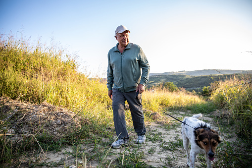 Man Enjoying Walking His Dog