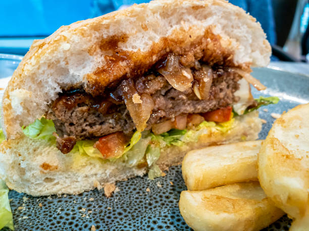 istock Hamburger sliced in half to reveal the succulent ingredients 1349255944