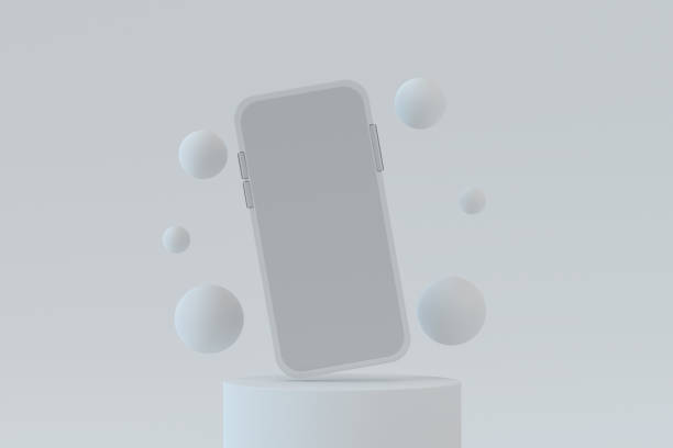 Transparent glass smartphone with blank screen and flying spheres