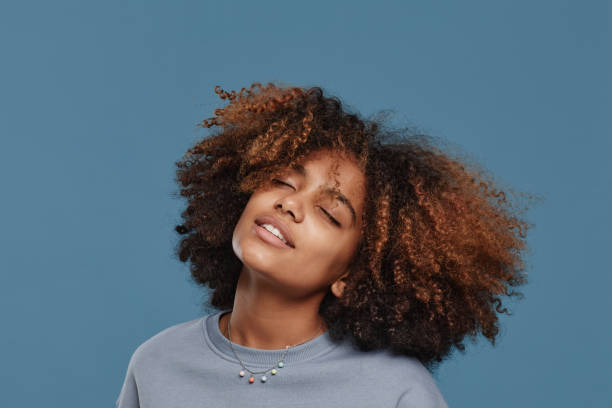 istock Young Woman with Natural Hair 1349257942