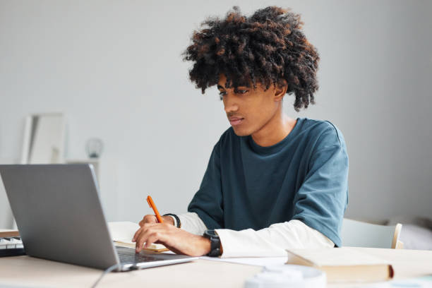 istock Teenage Boy Studying 1349257946