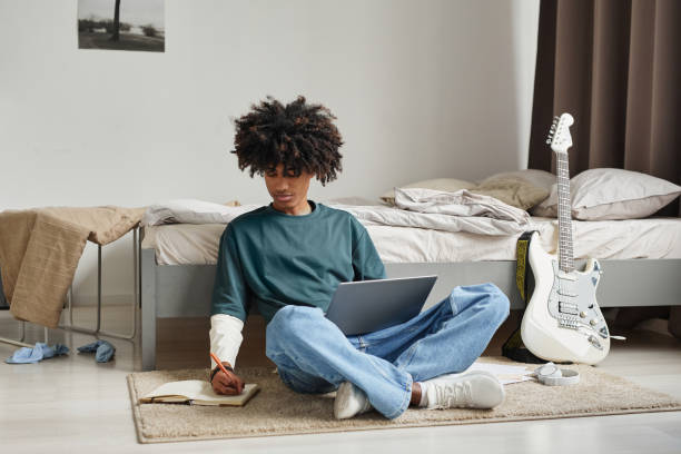 African American Teenage Boy Studying