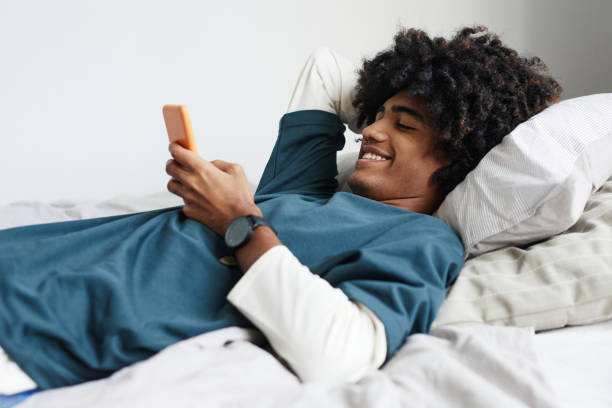 Teenage Boy Relaxing on Bed