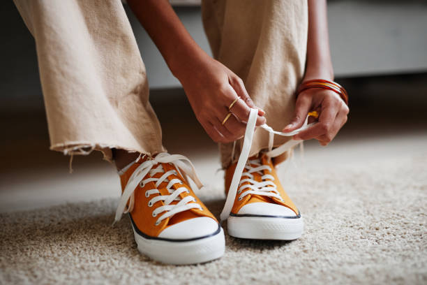 istock Girl Tying Shoes Close Up 1349258084