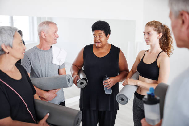 istock People discussing yoga training 1349259658
