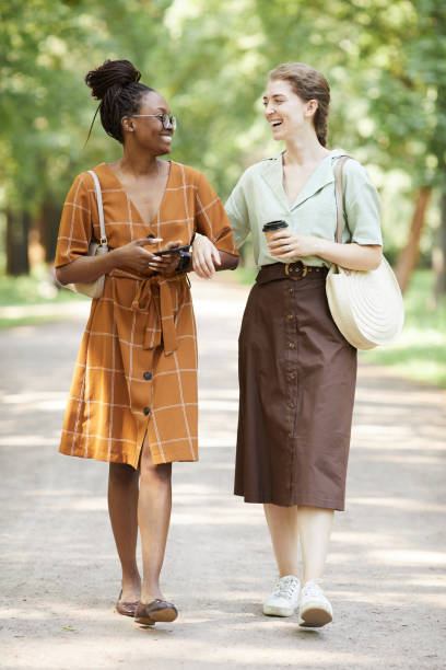 istock Two Smiling Young Women in Park 1349260475