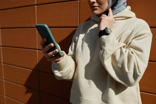 istock Middle Eastern Woman Using Smartphone Outdoors 1349260747