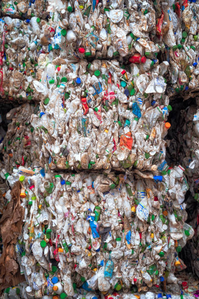 istock Bundle of pressed plastic bottles prepared for a garbage recycling on waste recycling plant. Camera moves forward. Pollution problem. Stabilized video 1349261591