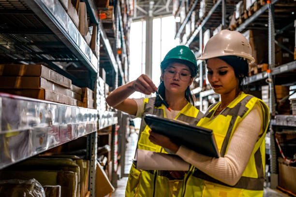 istock Warehouse worker checking stock levels 1349268259