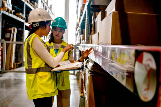 istock Warehouse worker checking stock levels 1349268428