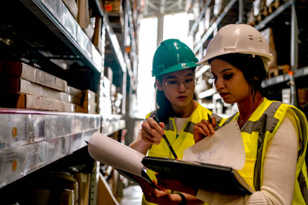 istock Warehouse worker checking stock levels 1349269010