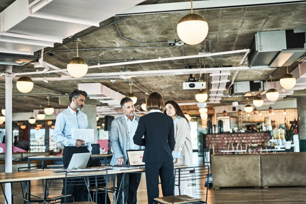 istock Group of business people having meeting around a table 1349269016