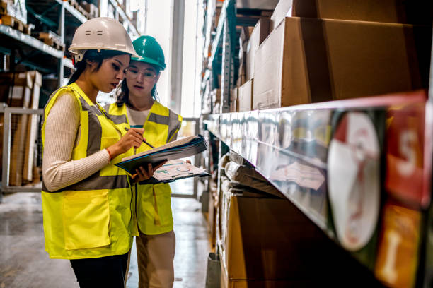 istock Warehouse worker checking stock levels 1349269029