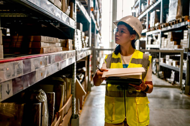 istock Warehouse worker checking stock levels 1349269175