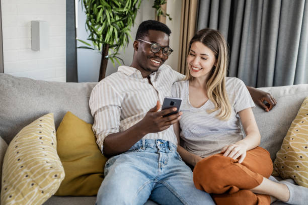 istock Portrait of a couple using smart phone 1349269236