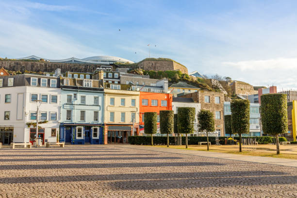 Saint Helier central square with fort Regent int the background, bailiwick of Jersey, Channel Islands Saint Helier central square with fort Regent int the background, bailiwick of Jersey, Channel Islands jersey england stock pictures, royalty-free photos & images