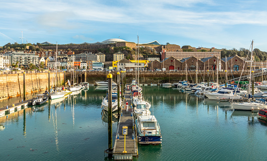 Marina with yacht and city in the background, Saint Helier, bailiwick of Jersey, Channel Islands