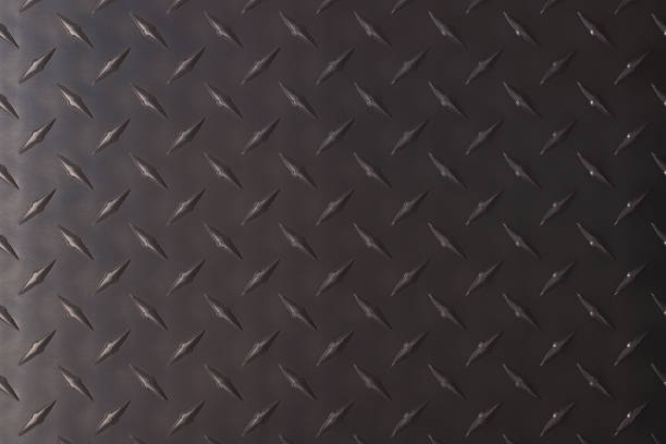 istock Dark metal texture with a corrugated print. iron plate background 1349271180