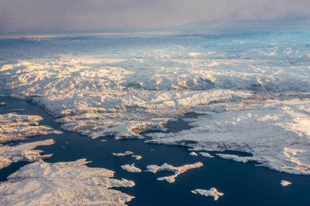 Greenlandic ice cap with frozen mountains and fjord aerial view, near Nuuk, Greenlandg Greenlandic ice cap with frozen mountains and fjord aerial view, near Nuuk, Greenland greenland stock pictures, royalty-free photos & images