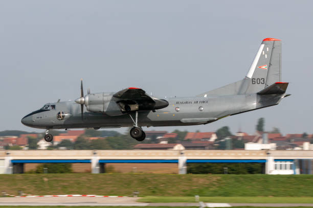 Hungarian Air Force Antonov An-26 transport aircraft on approach to land at Payerne Airport. Payerne, Switzerland - September 4, 2014: Hungarian Air Force Antonov An-26 twin engine military transport aircraft on approach to land at Payerne Airport. antonov an 26 stock pictures, royalty-free photos & images