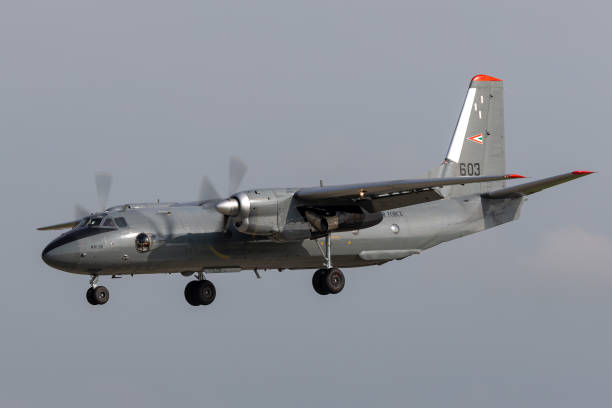 Hungarian Air Force Antonov An-26 transport aircraft on approach to land at Payerne Airport. Payerne, Switzerland - September 4, 2014: Hungarian Air Force Antonov An-26 twin engine military transport aircraft on approach to land at Payerne Airport. antonov an 26 stock pictures, royalty-free photos & images