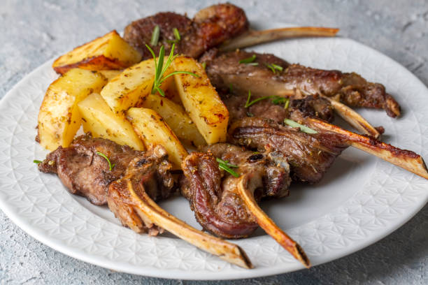 Grilled lamb chops and potatoes in delicious view Grilled lamb chops and potatoes in delicious view lamb meat stock pictures, royalty-free photos & images