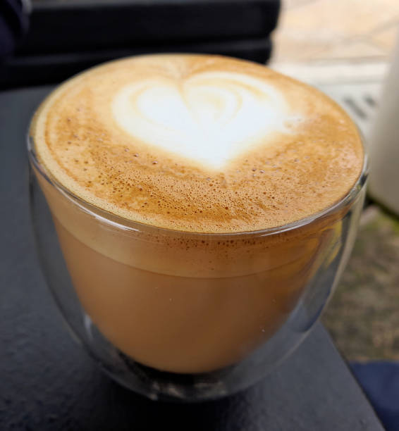 istock Cup of coffee latte with heart shape 1349280715
