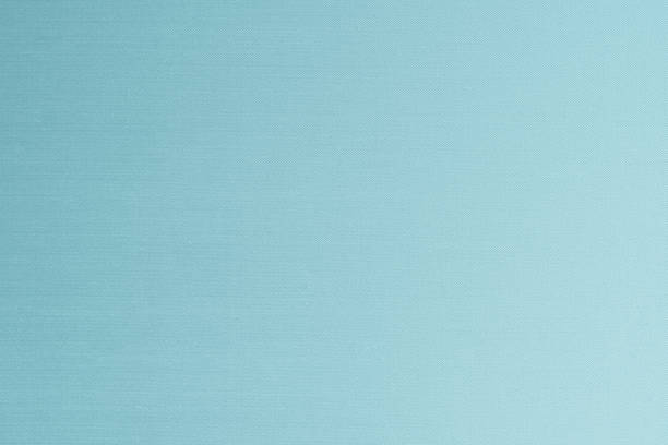 istock Blended cotton silk fabric wallpaper texture pattern background in light cyan tuquoise blue green color 1349286981