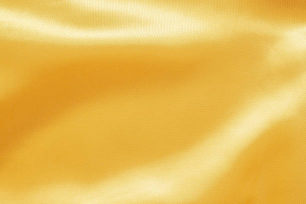 istock Abstract luxury gold fabric with soft wave texture background 1349287181