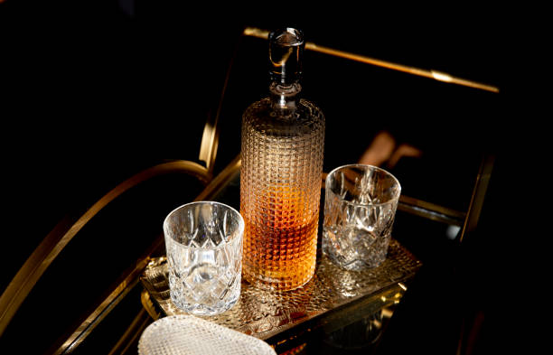 Whisky Decanter Set Whisky decanter and two crystal glasses. bourbon whiskey photos stock pictures, royalty-free photos & images
